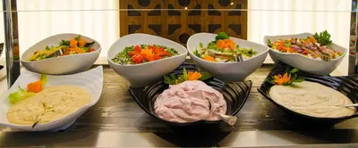 a group of bowls of food on a table at Rodon Hotel and Resort in Agros