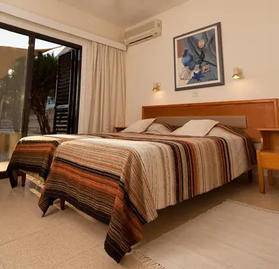 a bedroom with a large bed and a window at Annita Court Bock B, Apt3 in Ayia Napa