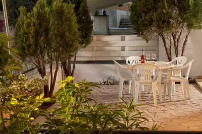 a white table and chairs on a patio at Annita Court Bock B, Apt3 in Ayia Napa