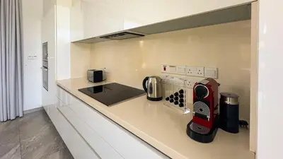 a kitchen with a counter with a toaster and a appliance at Vivo Mare 3 Bedroom Villas in Ayia Napa