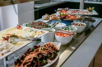 a buffet line with many different types of food at Lebay Beach Hotel in Larnaka