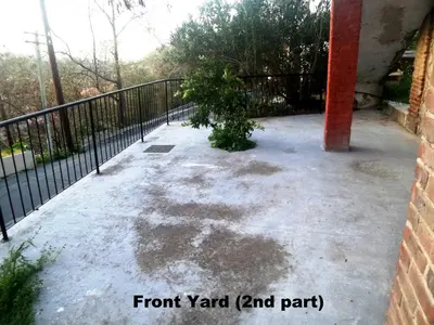 a patio with a fence and a tree at Metaxas Mansion in Kakopetria