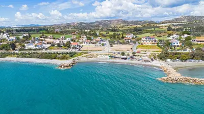 an aerial view of a small town on the beach at Villa Joan in Ayios Theodhoros