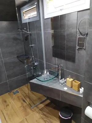 a bathroom with a sink and a shower at Takis apartments in Ayia Napa
