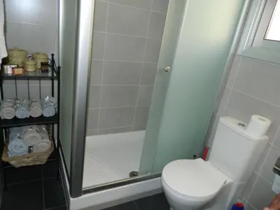 a bathroom with a toilet and a shower at Family Nest In The Heart Of Limassol in Limassol