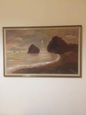 a painting of the ocean on a wall at Artemis House in Limassol