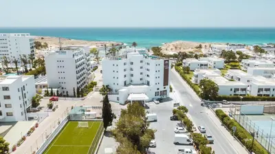 an aerial view of a city with buildings and the ocean at Pavlo Napa Beach Hotel in Ayia Napa