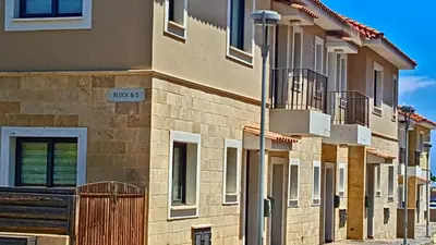 a street sign on the side of a building at Kapparis town house in Paralimni