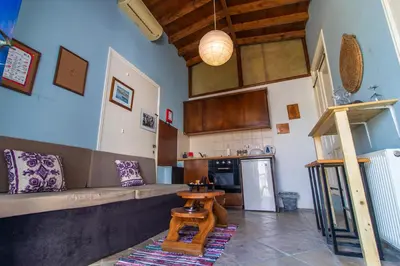 a kitchen with a couch and a table in a room at Kalavasos View Traditional Apartments in Kalavasos