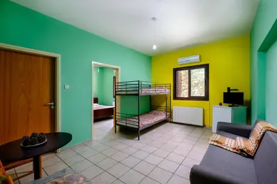 a living room with a bunk bed and a couch at Platres Valley Houses in Platres