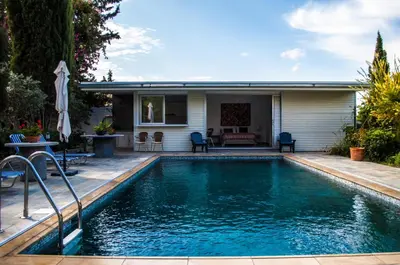 a swimming pool in the backyard of a house at Idyllic studio with private pool in Nicosia