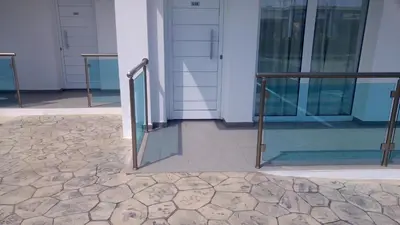a building with glass doors and a tile floor at Kaos Hotel Apartments in Ayia Napa