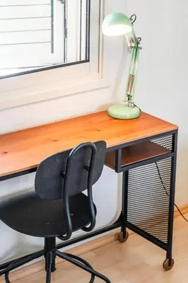 a desk with a chair and a lamp on it at Villa Venus by Ezoria Villas in Pervolia