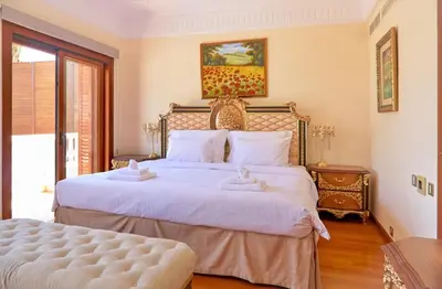 a bedroom with two beds with towels on them at Limassol Beachfront Holiday Villa in Limassol