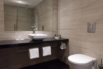 a bathroom with a sink and a toilet at Sunrise Beach Hotel in Protaras