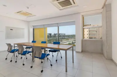 a conference room with a table and chairs at UC Hall Residence in Nicosia