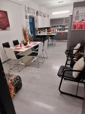 a dining room with chairs and a table in a room at Andros Residence in Limassol