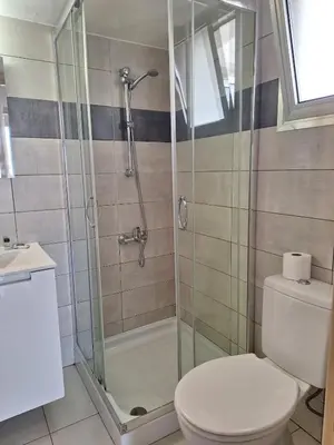 a bathroom with a shower and a toilet at Delphi Court - large 1 bed -sleeps 4, Near sea/beach - free wifi in Limassol