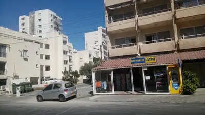 a small car parked in front of a building at LCA4 flat for you apartment in Larnaka