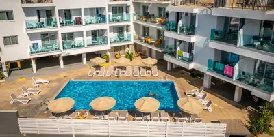 an aerial view of an apartment building with a swimming pool at A Maos Hotel Apartments in Ayia Napa