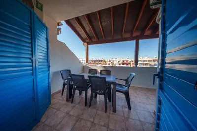 a table and chairs on a balcony with a view at The Valley Beyond in Paralimni