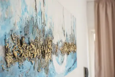 a painting hanging on a wall in a room at Cornelia Hotel in Ayia Napa