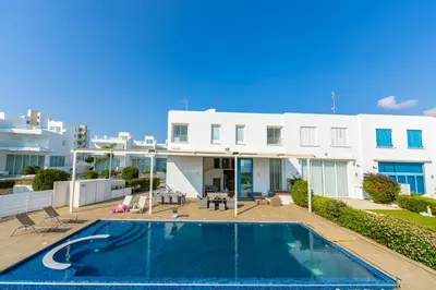 an image of a house with a swimming pool at Infinity Villa in Protaras
