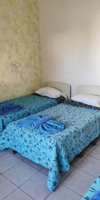 two beds sitting next to each other in a room at Simos Magic Hotel Apts in Ayia Napa