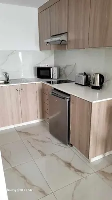 a kitchen with stainless steel appliances on a counter at Simos Magic Beach Hotel Apts in Ayia Napa