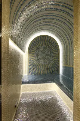 a bathroom with a tub with a tile ceiling at Opera Exclusive Apts by TrulyCyprus in Limassol