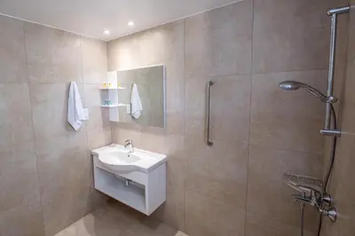 a bathroom with a sink and a shower at La Casa Di Napa Apartments in Ayia Napa
