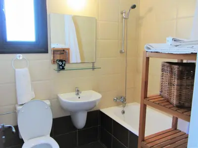 a bathroom with a toilet and a sink at Villa Jade in Paralimni
