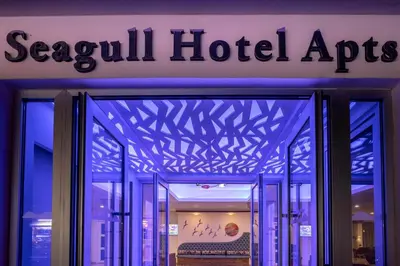 a store front with a sign that reads seoul hotel agents at Seagull Hotel Apartments in Protaras