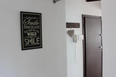 a chalkboard on a wall next to a door at Glabur Stays - The Cozy 2 BDR - Nicosia City, Free Parking & Wifi, Welcomes You!!! in Nicosia