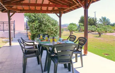 a table and chairs sitting under a pavilion at Stunning Home In Maroni-Larnaca in Pervolia
