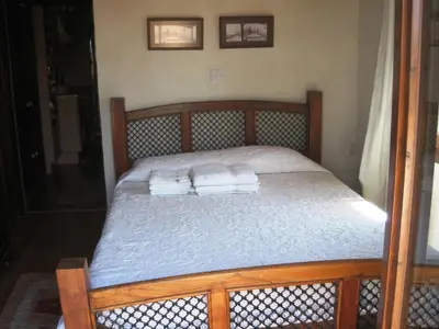 a bedroom with a bed with two towels on it at Oinochori in Vouni