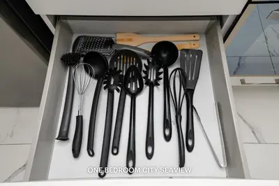 a drawer filled with lots of kitchen utensils at Lazuli Seaview Apartments 2Bdr in Larnaka