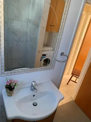 a bathroom with a sink and a mirror at Villa Emiliana in Paralimni