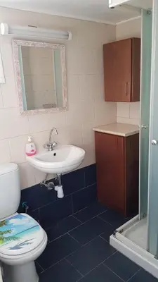 a bathroom with a toilet and a sink at Pirgos beach house in Larnaka