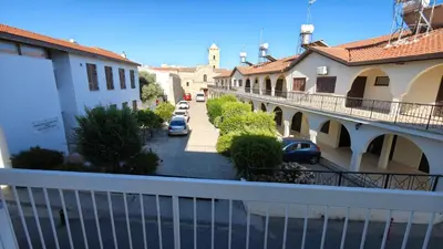 a balcony with a view of a street and buildings at St Lazarus City Hotel in Larnaka