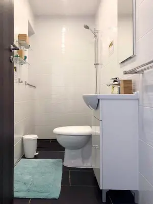 a white bathroom with a sink and a toilet at Ayia Napa GO SEA Sunny Apt with Terrace 5 min to Beach in Ayia Napa