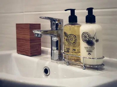 a bathroom sink with two bottles of soap on it at Ayia Napa GO SEA Sunny Apt with Terrace 5 min to Beach in Ayia Napa