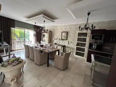 a kitchen and dining room with a table and chairs at SeaView 6 Bedroom Villa & Private Pool in Limassol
