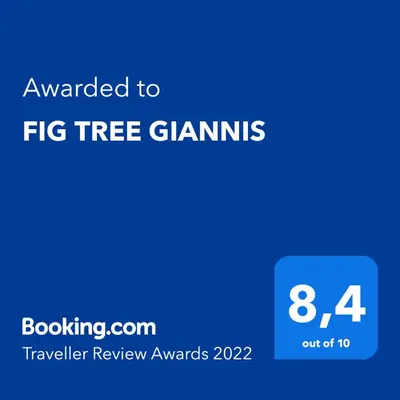 a blue sign with the text awarded to fig tree gums at FIG TREE GIANNIS in Protaras