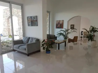a living room with a couch and a table at Melini Hotel Suites in Protaras