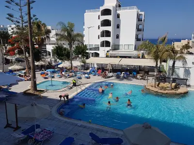 a group of people in a pool at a hotel at Melini Hotel Suites in Protaras