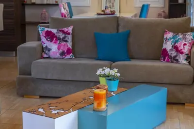 a living room with a couch and a coffee table at Protaras Villa Rocco in Paralimni