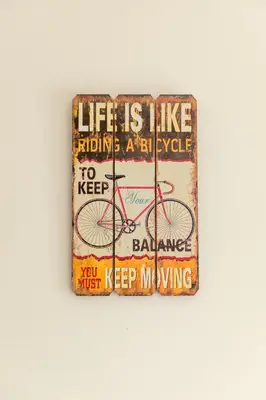 a sign on a wall that says life is like riding a bicycle at Savvas City Centre Flat in Larnaka