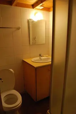 a bathroom with a toilet and a sink and a mirror at Xenis House in Galata