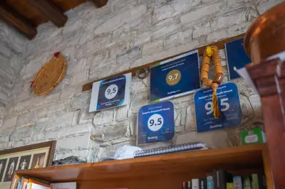 a stone wall with blue signs on a wall at Iosiphis Stonebuilt House in Pano Lefkara